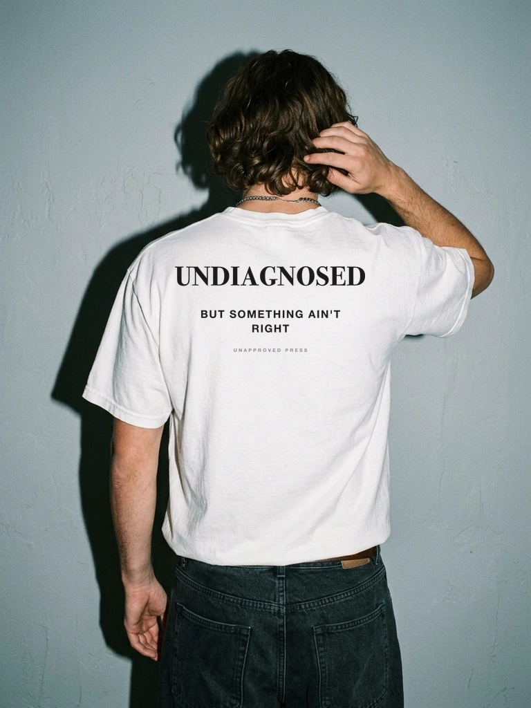 UNDIAGNOSED — UNAPPROVED PRESS Heavyweight Tee in White — Lookbook Editorial Upper Back View (Brunette Model)